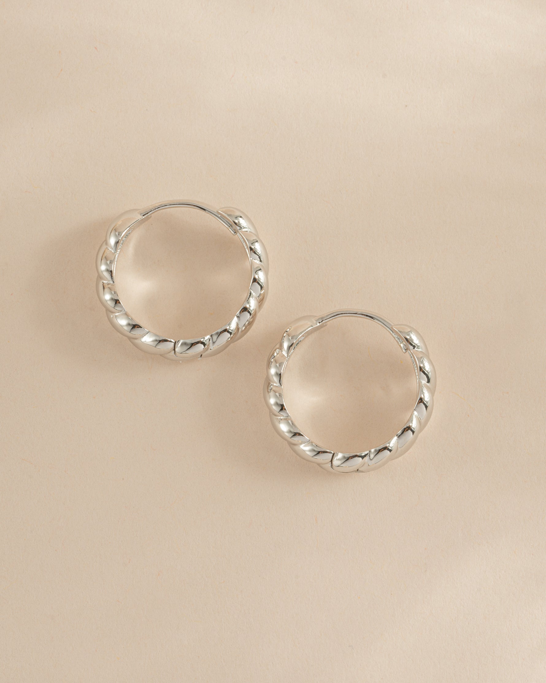Sami Jewels Jacky Hoop Earrings in sterling silver, croissant-shaped hoop earrings shown in side profile view