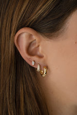 Gold studded croissant hoop earrings by Sami Jewels worn on a model, showcasing stylish and trendy jewelry design.