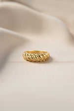 Gold Croissant Ring by Sami Jewels featuring a detailed, stylized croissant design in a front-view shot.