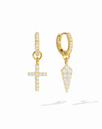 Gold cross and dagger charm huggie earrings by Sami Jewels with white background, showcasing their detailed design and secure fit.