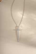 Sterling silver cross necklace from Sami Jewels featuring a simple, elegant pendant design on a chain.