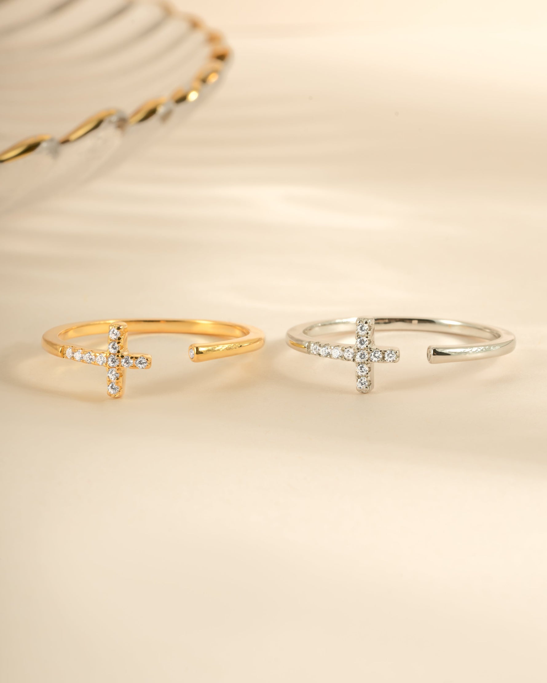 Gold and sterling silver cross open cuff ring from Sami Jewels, showcasing a stylish and contemporary jewelry piece.