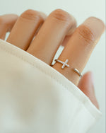 Sterling silver cross open cuff ring from Sami Jewels, featuring a modern design with an open cuff style and a prominent cross detail.