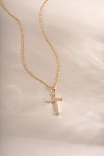 Gold cross pendant necklace by Sami Jewels featuring a sleek, elegant design perfect for everyday wear.