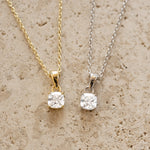 Sami Jewels cushion diamond pendant necklace with gold and silver accents, showcasing a sparkling diamond centerpiece.