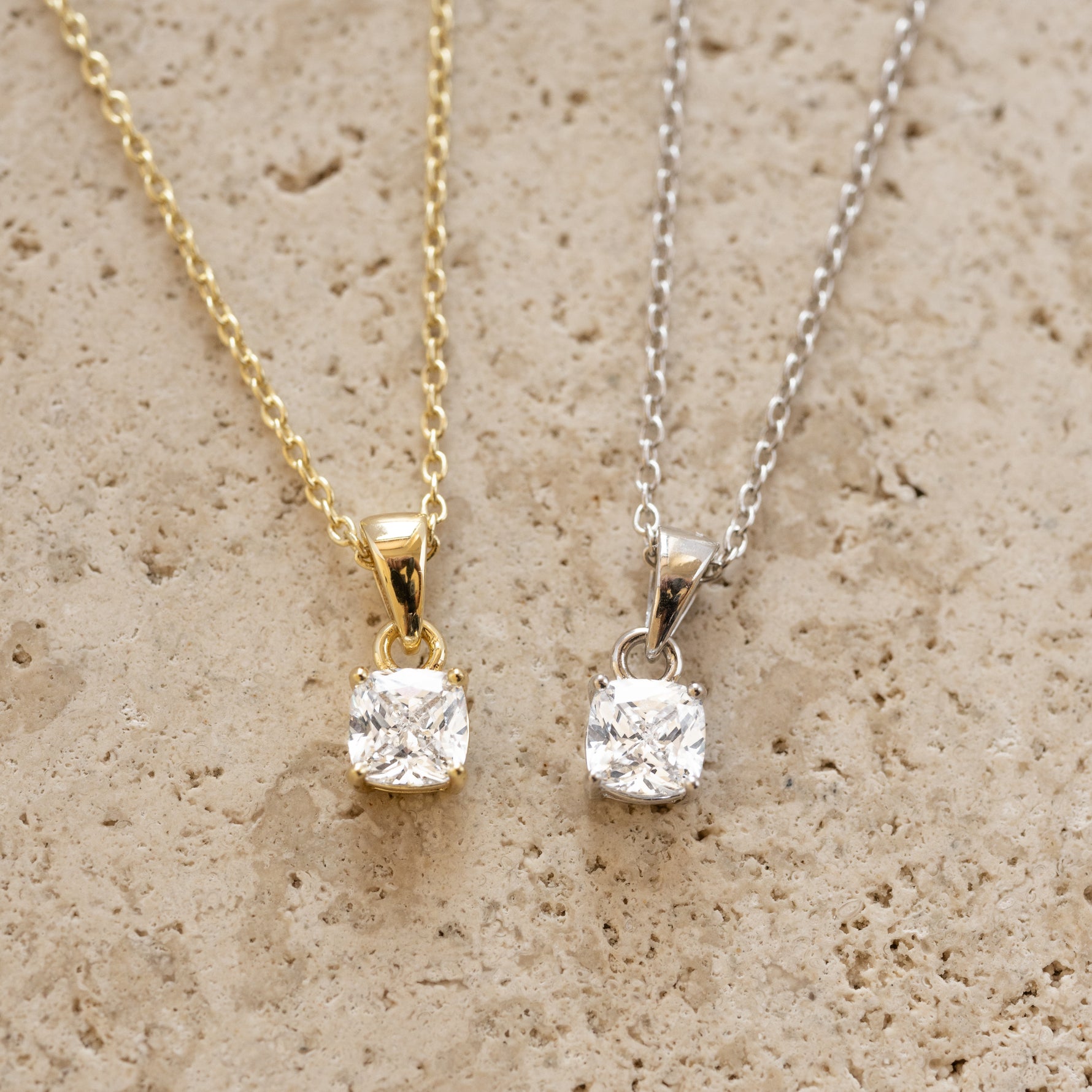 Sami Jewels cushion diamond pendant necklace with gold and silver accents, showcasing a sparkling diamond centerpiece.