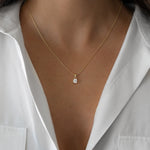 Gold cushion diamond pendant necklace by Sami Jewels featuring a sparkling diamond in a sleek cushion setting.