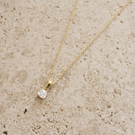 Gold cushion diamond pendant necklace by Sami Jewels, featuring a sparkling diamond centerpiece on a delicate chain.