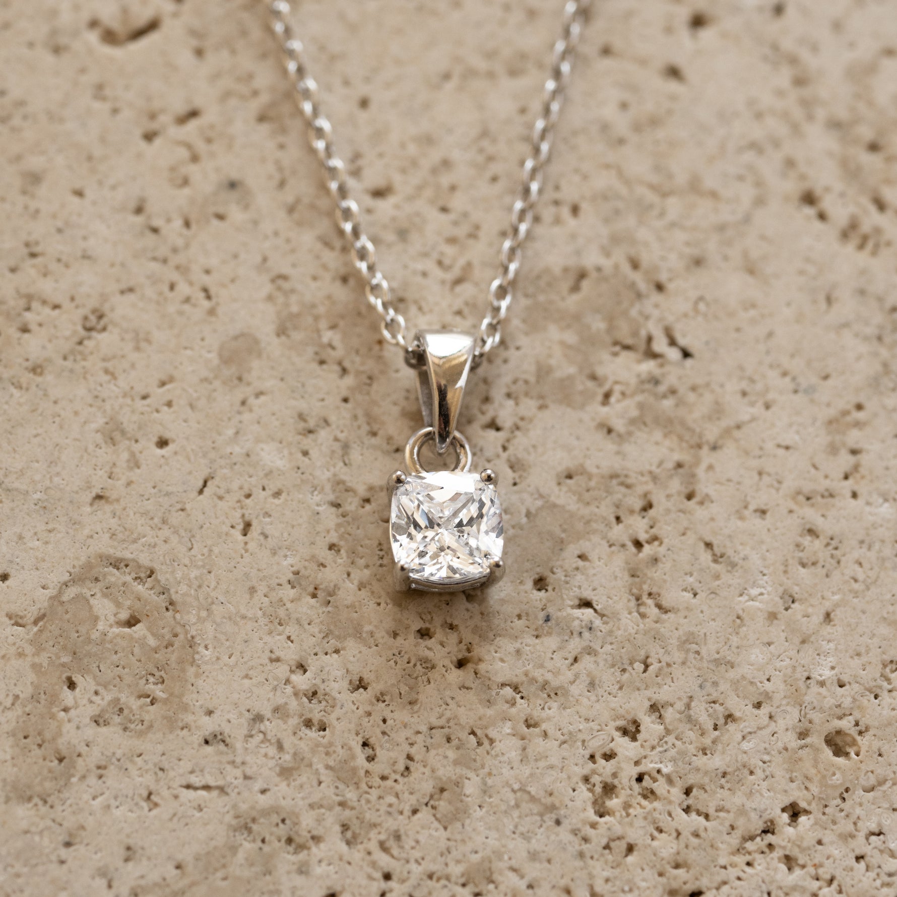 Sterling silver cushion diamond pendant necklace from Sami Jewels featuring a sparkling square-cut diamond centerpiece.