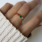 closeup image of 4 stone ring on custom birthstone