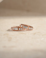 Rose gold CZ baguette huggie earrings by Sami Jewels, side view showcasing sleek design and sparkling stones.