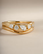 Close-up image of gold chevron ring set featuring 5 CZ stones.