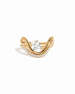White background image of gold cz oval wave engagement ring set.