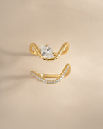 Front view of gold cz wavy engagement ring set with pavé band.