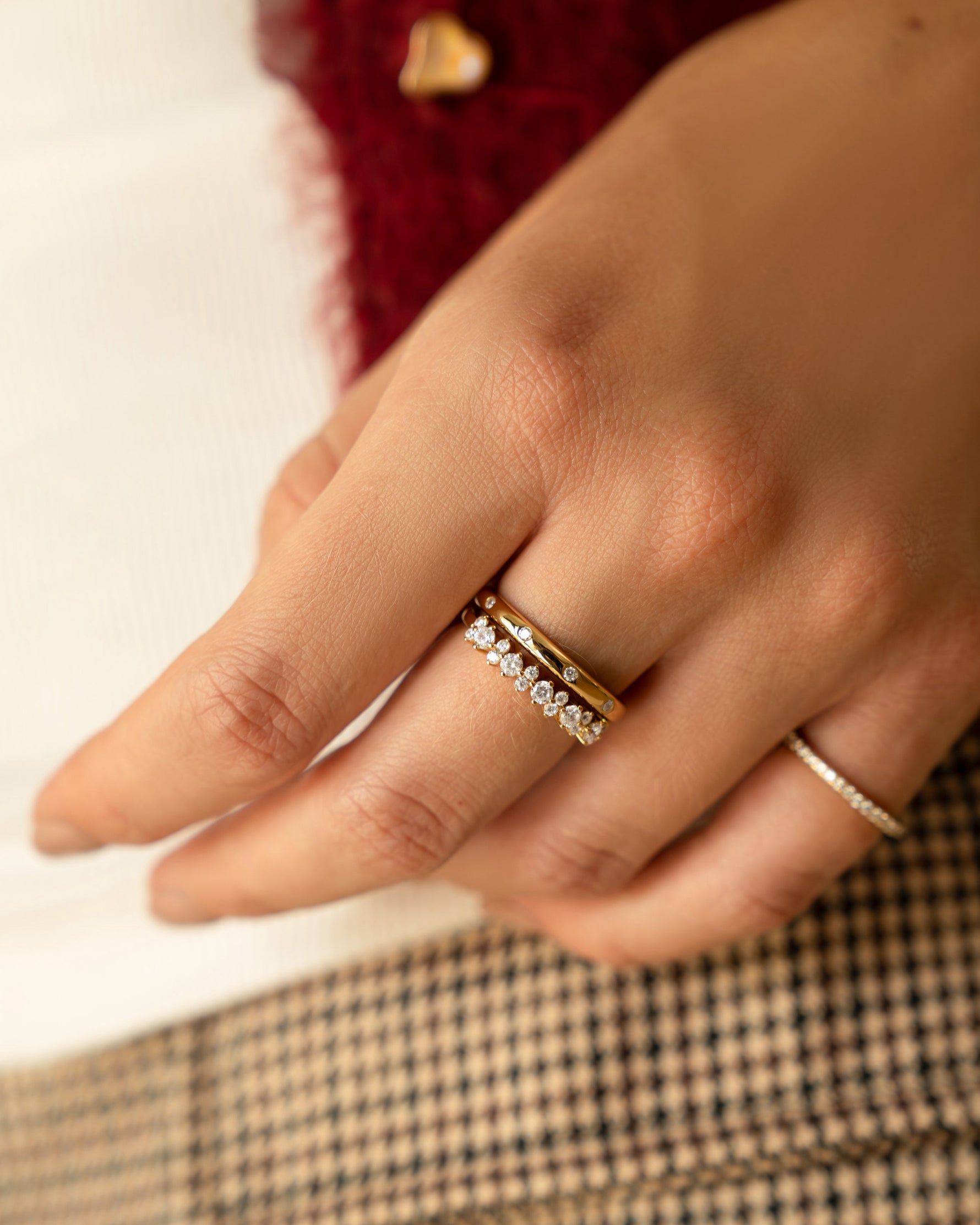 Gold CZ Stephanie stacking ring by Sami Jewels shown on model, featuring multiple slim bands with sparkling cubic zirconia accents.