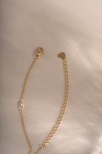 Dainty beaded pearl necklace by Sami Jewels with gold finish and lobster clasp closure, showcasing elegant jewelry design.