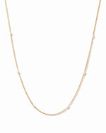 Dainty beaded pearl necklace by Sami Jewels featuring small white pearls on a delicate gold chain.