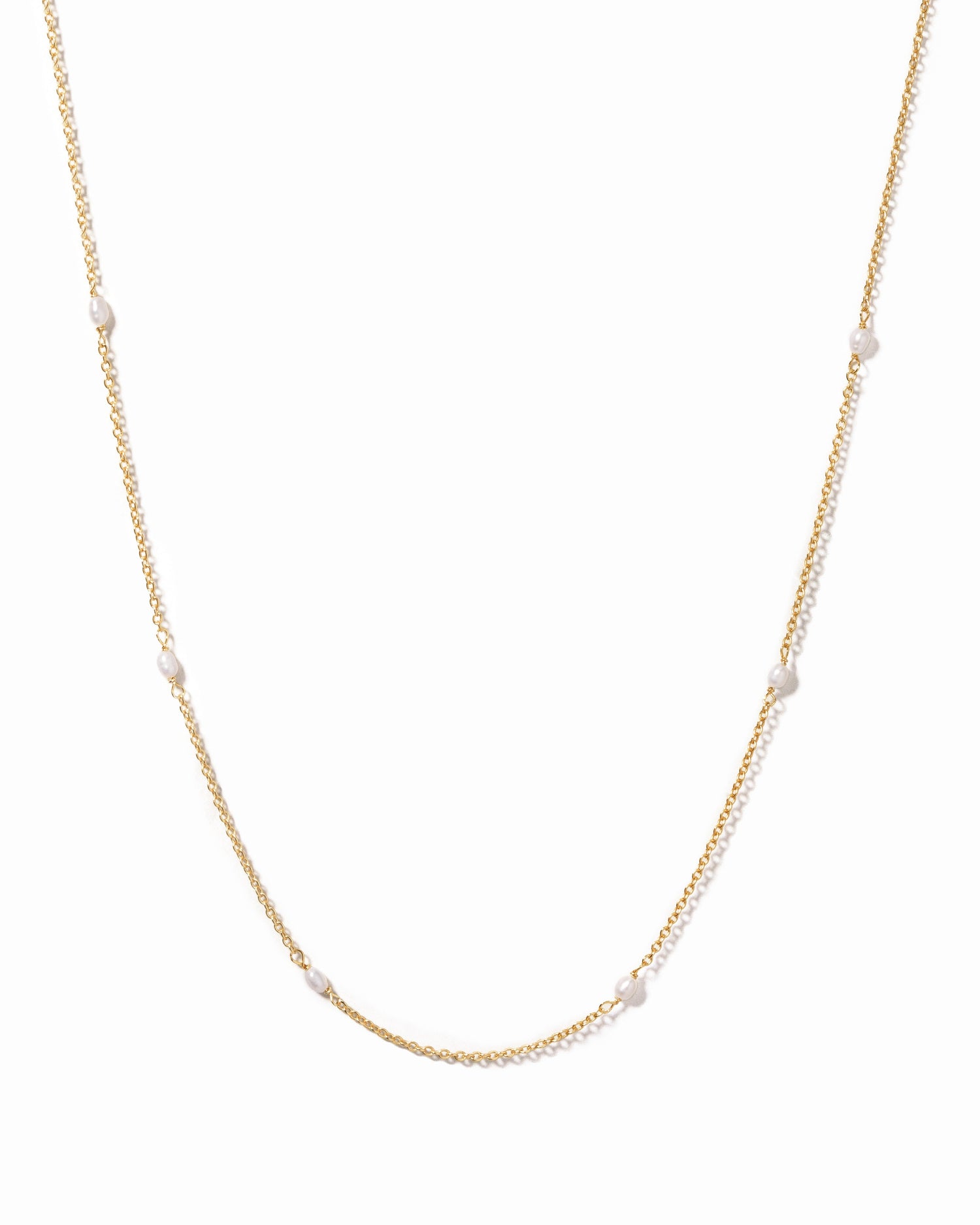 Dainty beaded pearl necklace by Sami Jewels featuring small white pearls on a delicate gold chain.