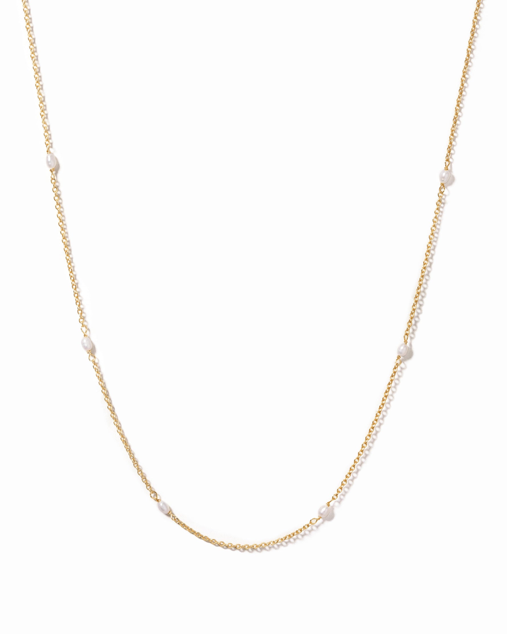 Dainty beaded pearl necklace by Sami Jewels featuring small white pearls on a delicate gold chain.