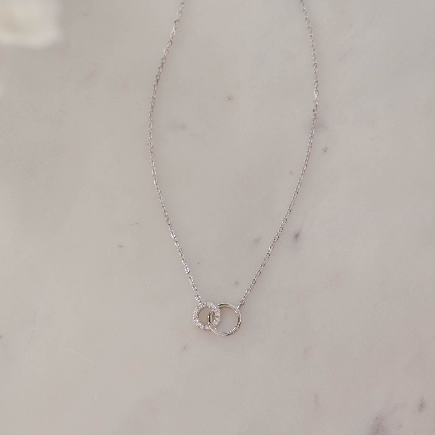 Dainty sterling silver bridal jewelry necklace on white background
