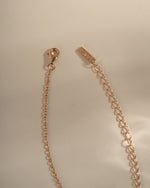 Dainty rose gold Chevron necklace with lobster clasp closure, featuring a sleek V-shaped pendant from Sami Jewels.