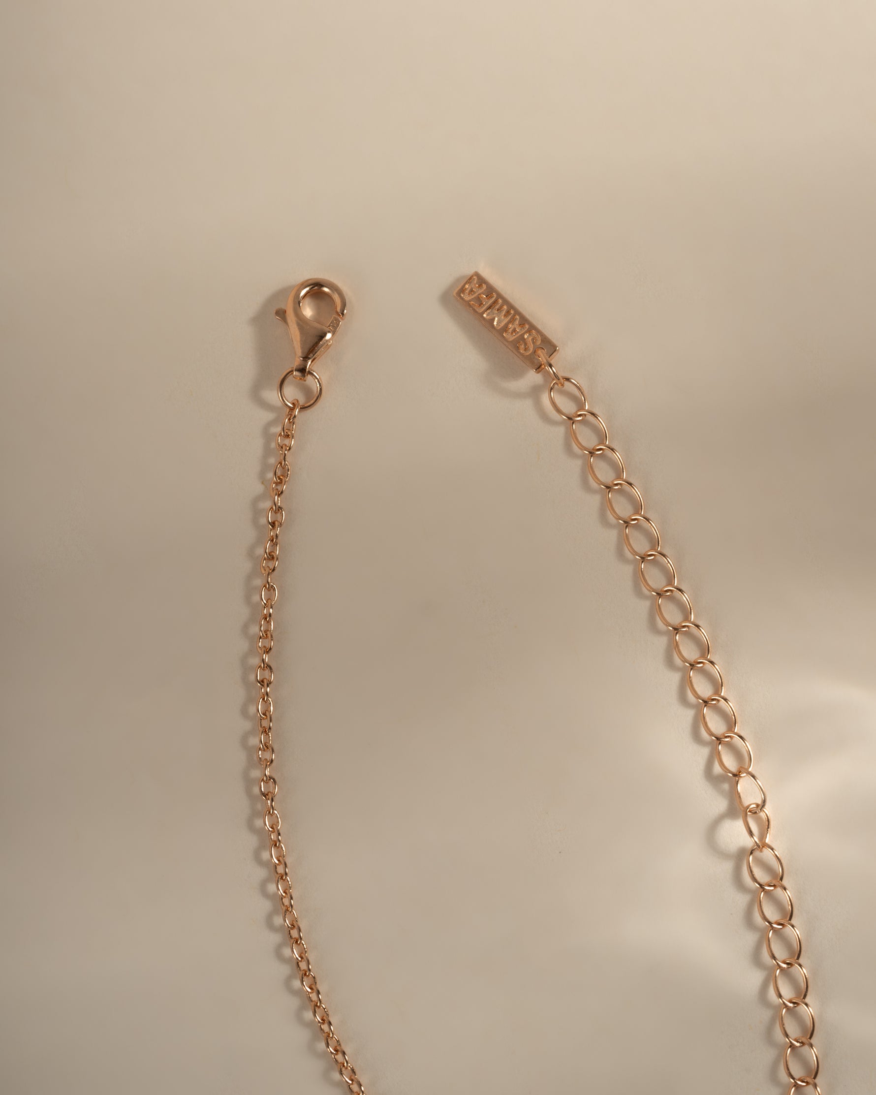 Dainty rose gold Chevron necklace with lobster clasp closure, featuring a sleek V-shaped pendant from Sami Jewels.