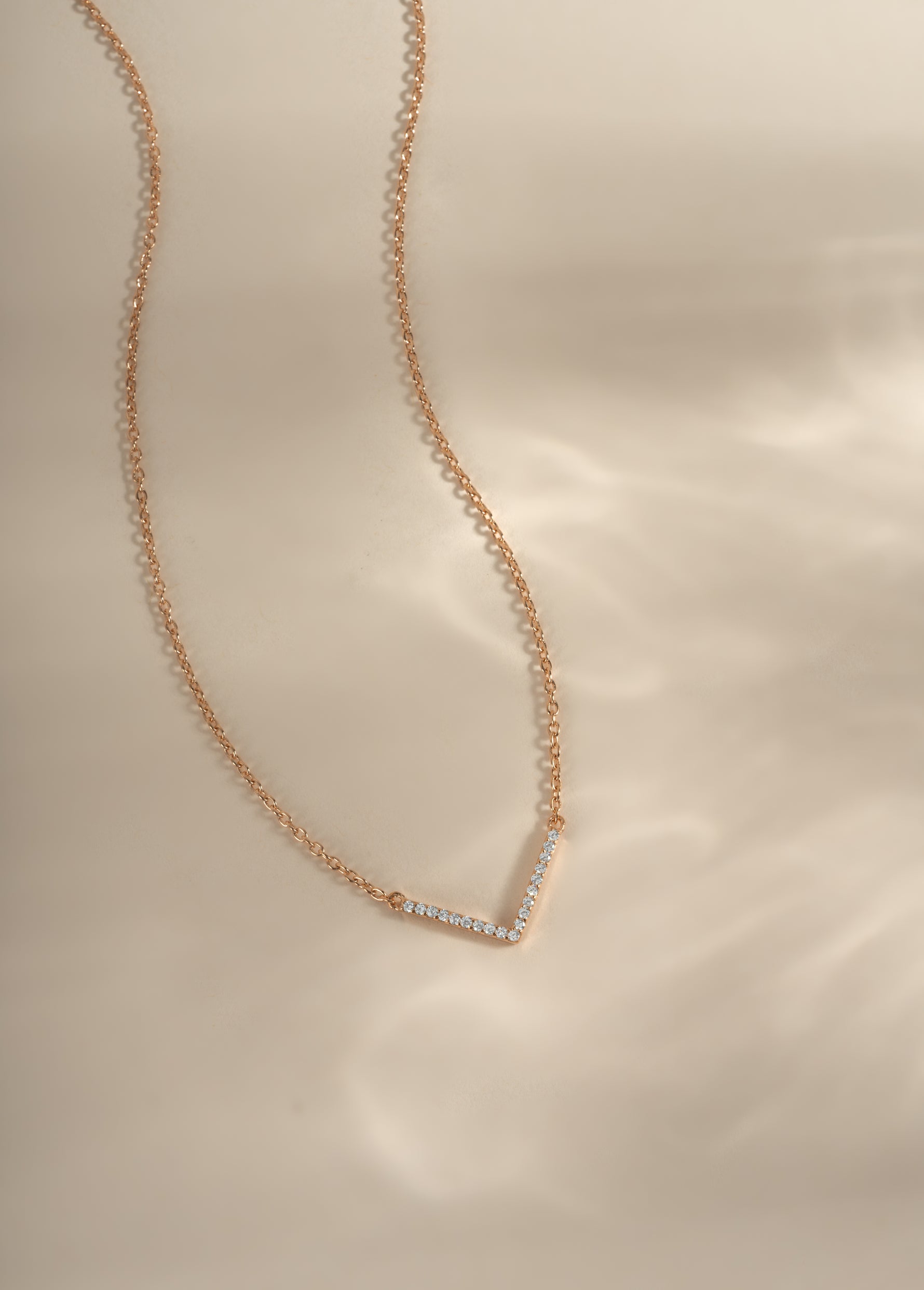 Dainty rose gold Chevron necklace by Sami Jewels featuring a sleek geometric design on a delicate chain.