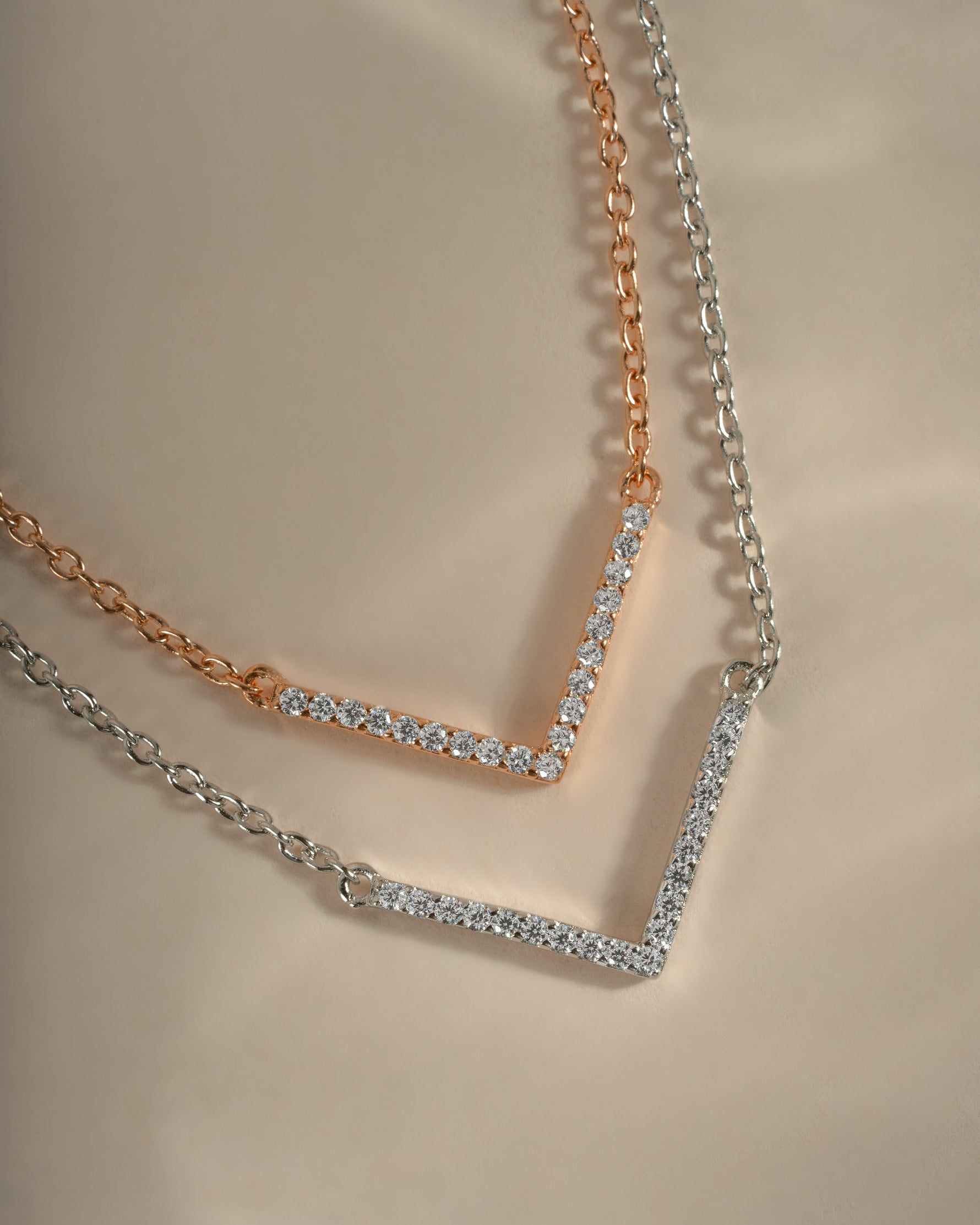 Dainty sterling silver and rose gold Chevron necklace from Sami Jewels, featuring a sleek, modern design.
