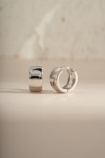 Dainty sterling silver small chunky hoop earrings by Sami Jewels, showcasing a modern and minimalist jewelry design.