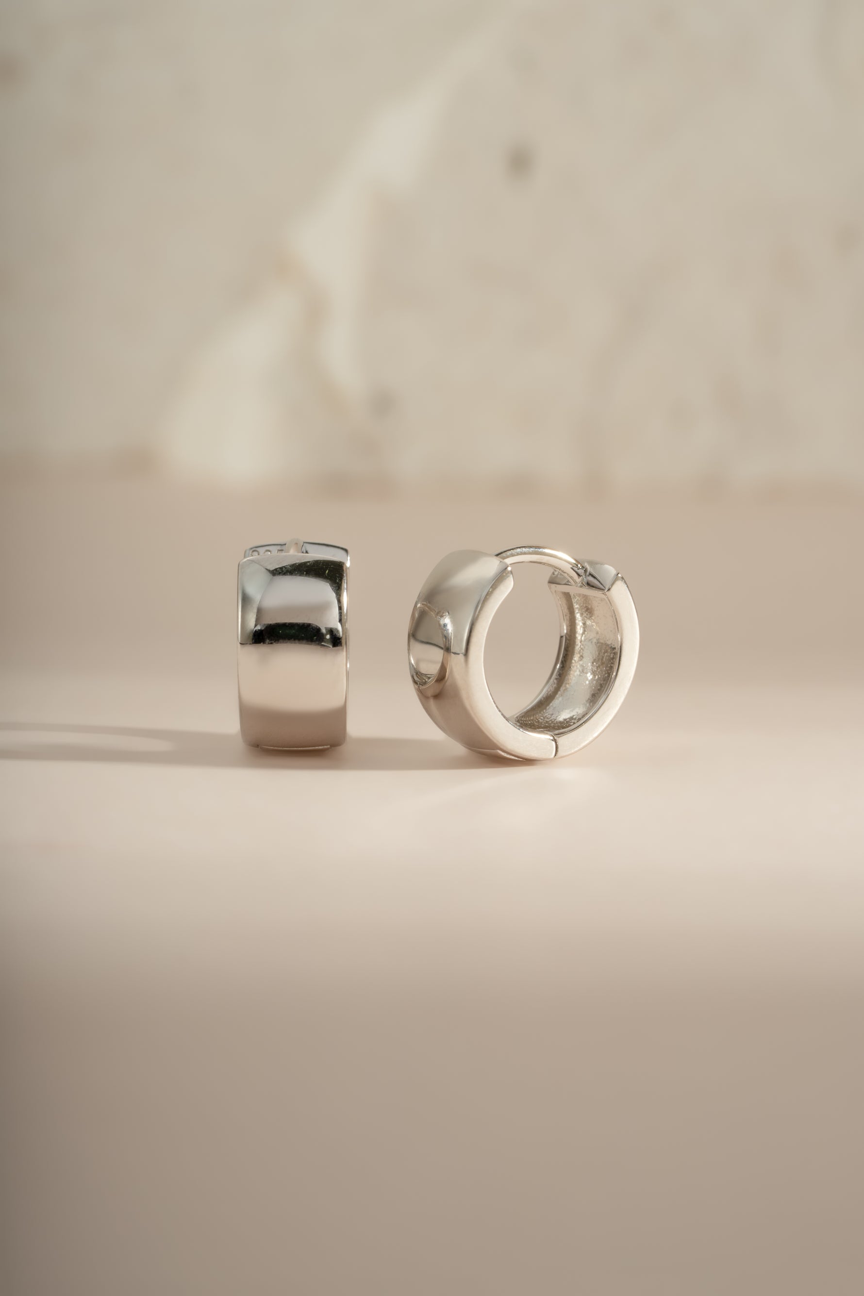 Dainty sterling silver small chunky hoop earrings by Sami Jewels, showcasing a modern and minimalist jewelry design.
