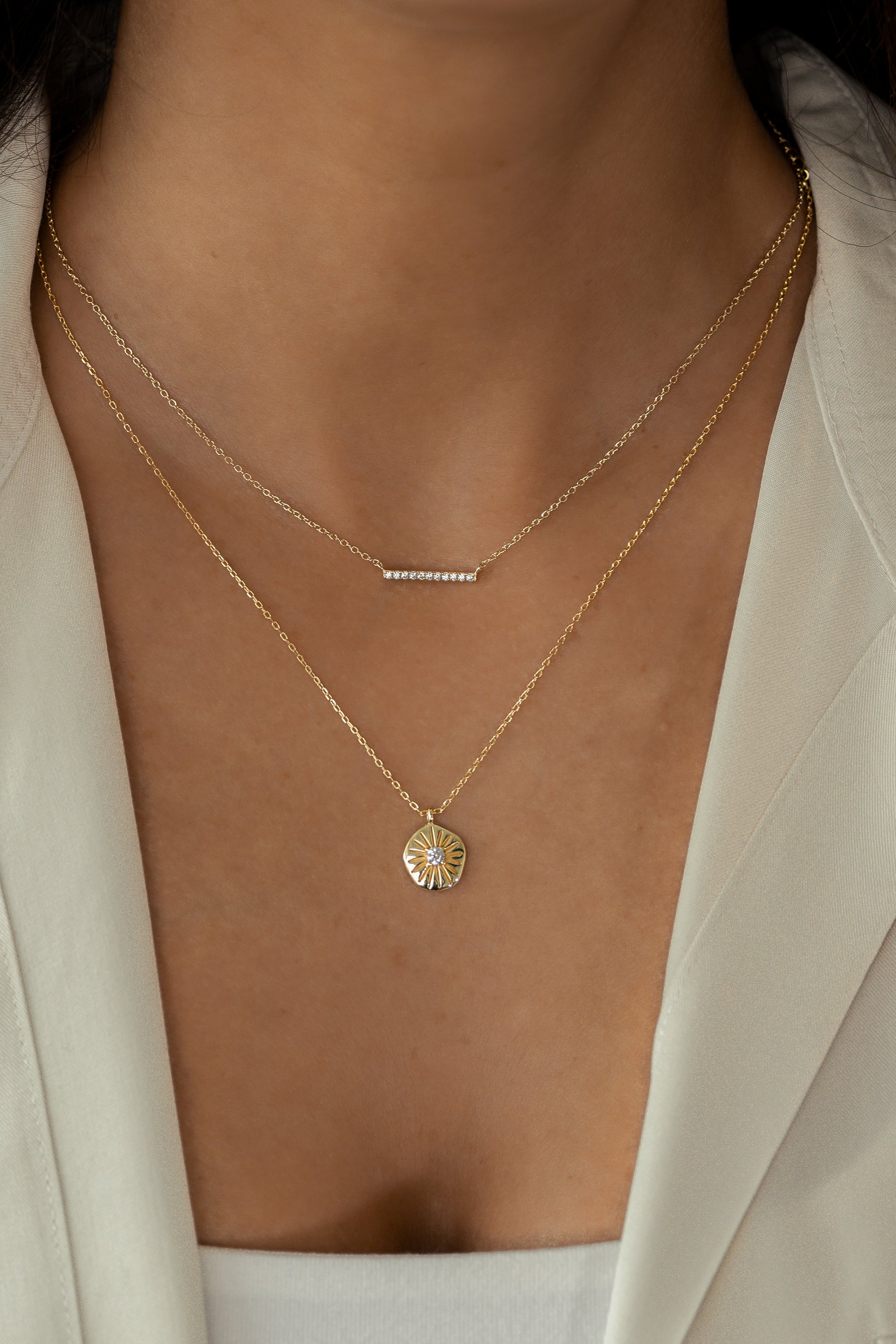 Gold dainty diamond bar necklace by Sami Jewels, featuring a slim horizontal bar design worn on a model.