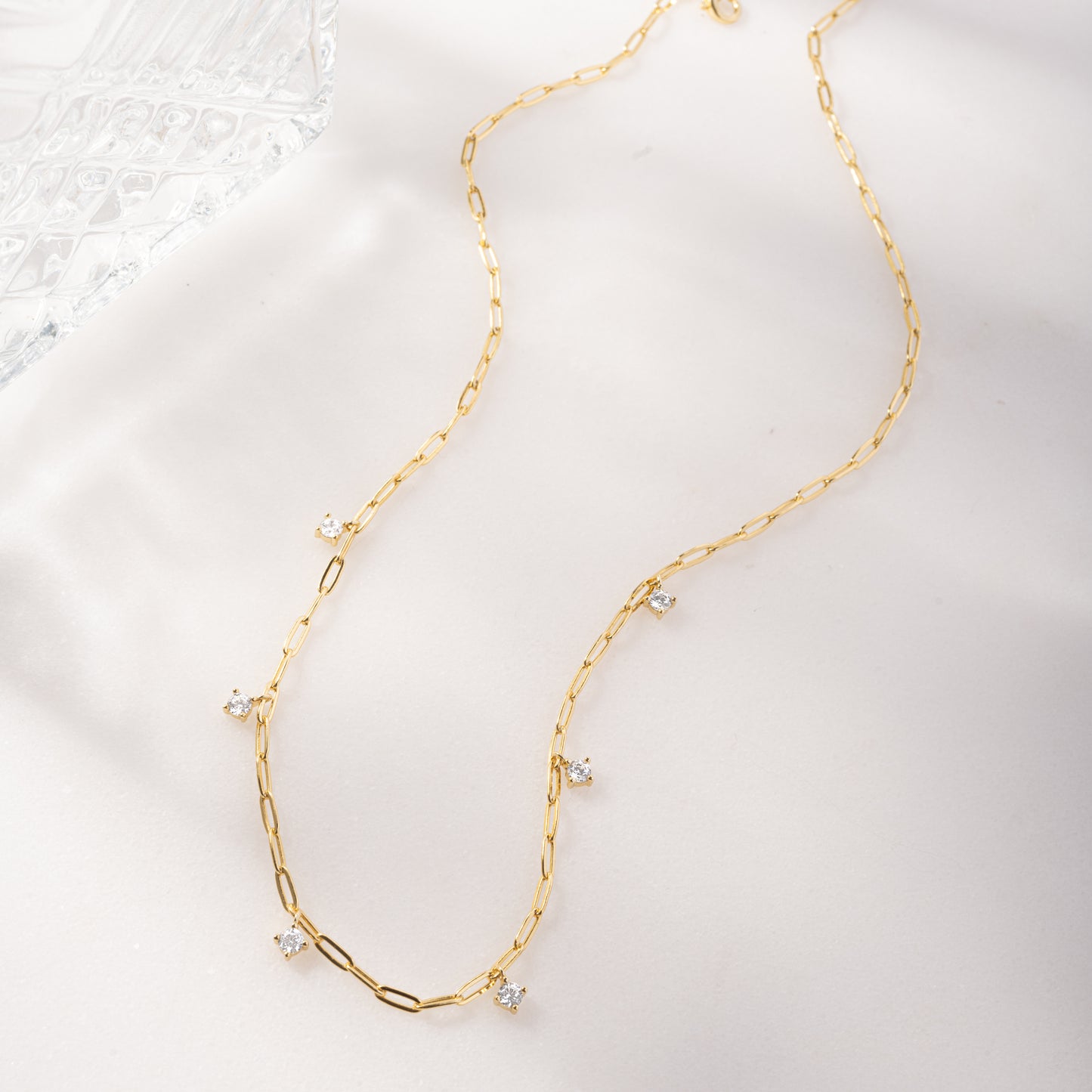 gold paperclip necklace with charms