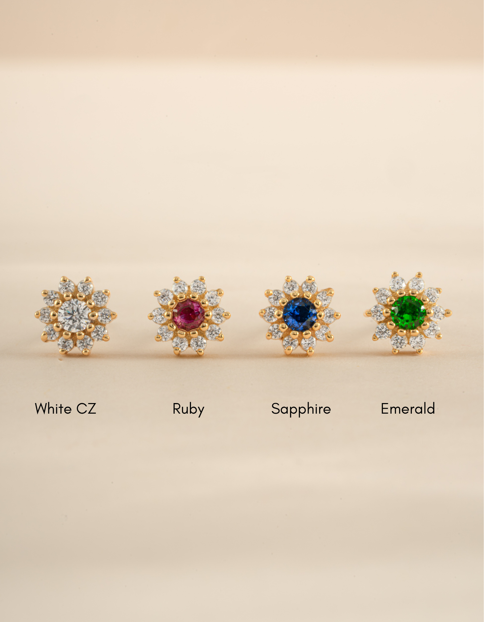 Gold flower earrings with small gemstones from Sami Jewels, featuring delicate petal designs and vibrant colored stones.