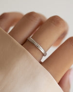 Sterling silver dainty fluted ring from Sami Jewels, showcasing a delicate, textured design on a model's finger.