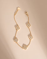 Dainty gold four-leaf clover bracelet with adjustable chain by Sami Jewels, featuring a delicate and elegant design.