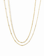 Dainty gold layering necklace set from Sami Jewels displayed against a white background.