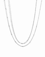 Dainty layering necklace set by Sami Jewels featuring sterling silver necklaces on a white background.