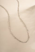 Dainty sterling silver layering necklace set by Sami Jewels featuring multiple delicate chain necklaces on a white background.