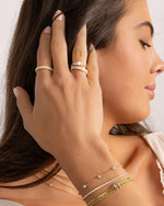 Dainty gold opal ring from Samijewels-527 featuring a smooth opal gemstone on a slender gold band.