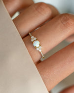 Dainty gold opal ring from Samijewels-527 featuring a smooth, polished opal gemstone set in a delicate gold band.