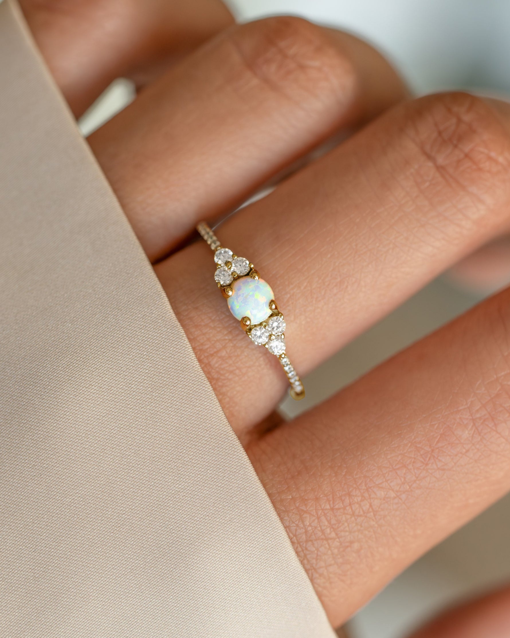 Dainty gold opal ring from Samijewels-527 featuring a smooth, polished opal gemstone set in a delicate gold band.