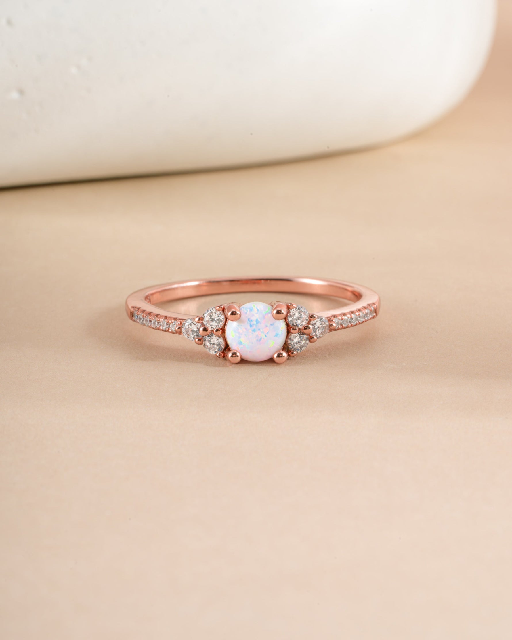 Dainty opal ring in rose gold with a smooth, polished band and a central opal gemstone, elegant jewelry by Samijewels-527.