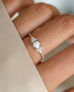 Dainty silver opal ring from Samijewels-527 featuring a smooth, polished opal gemstone set in a delicate band.