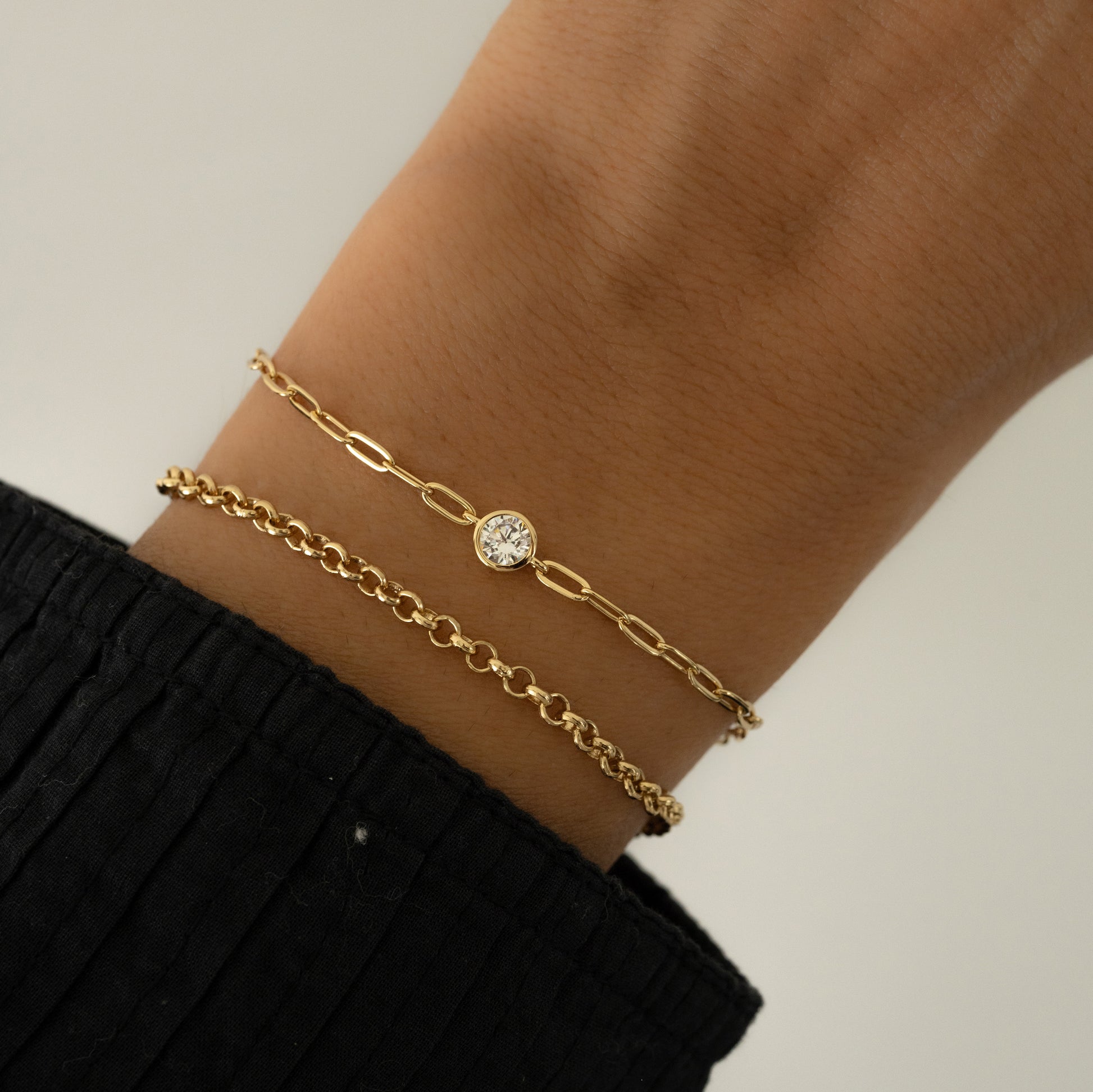 14k Gold plated Paper Clip Chain Bracelet and rolo chain bracelet on women's wrist