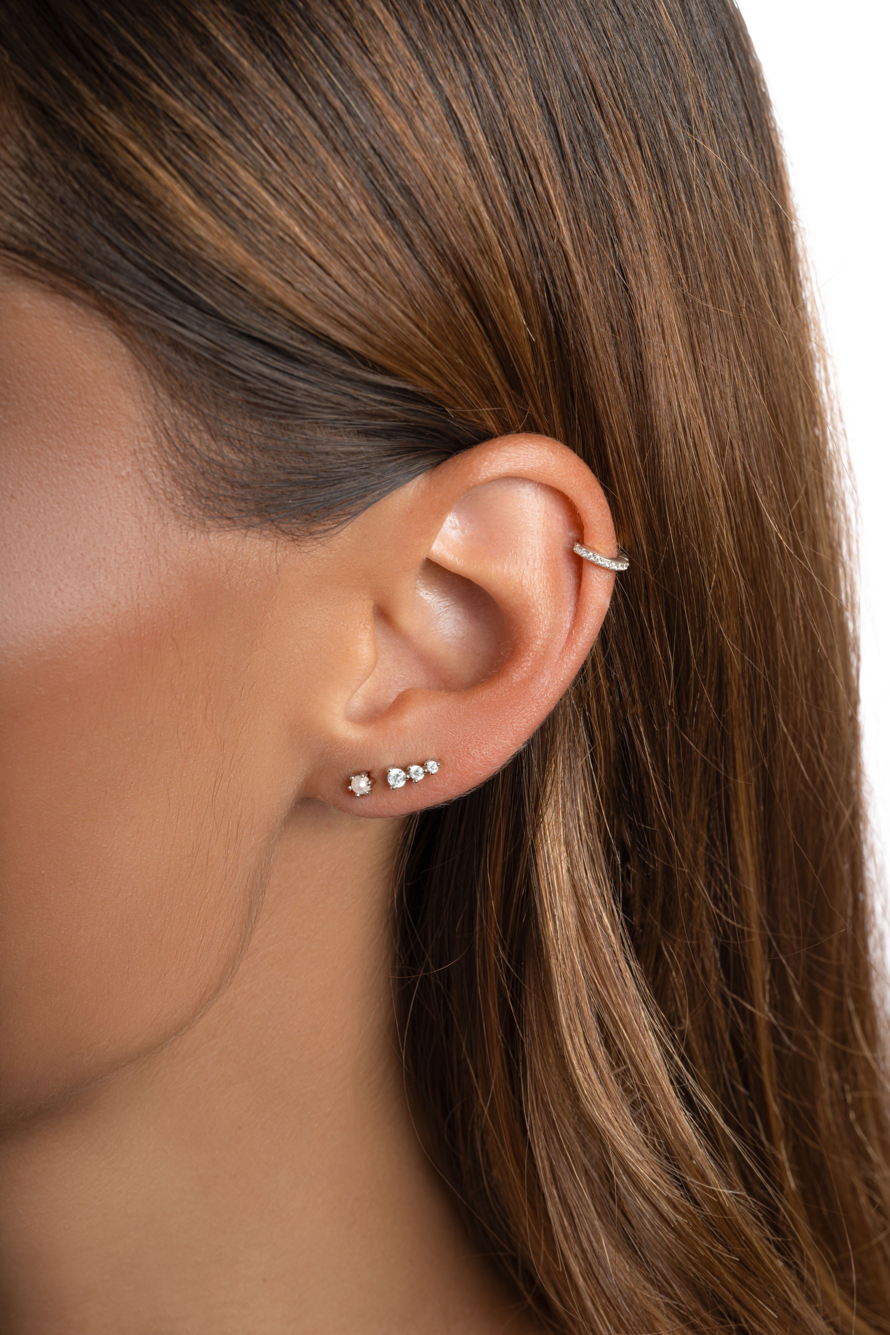 Sterling silver dainty pearl stud earrings by Sami Jewels featuring small, elegant pearls on simple earring posts.