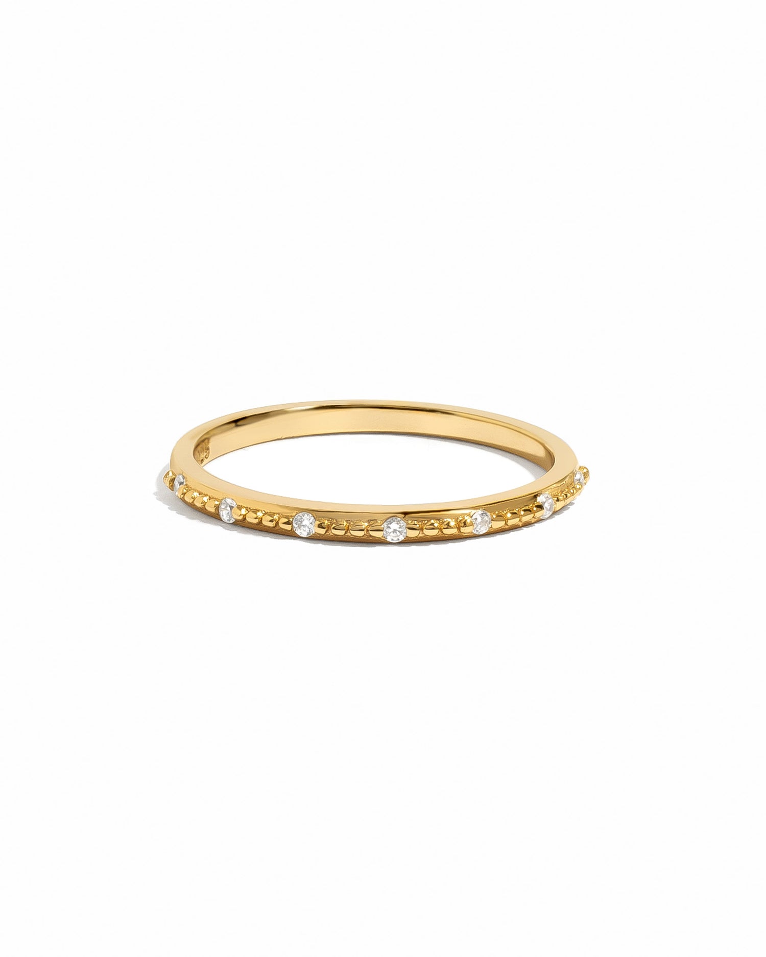 Dainty gold Mia stacking ring by Sami Jewels displayed on a white background, perfect for layered jewelry styles.