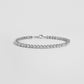 Silver diamond tennis bracelet gift for her, shown on white marble background