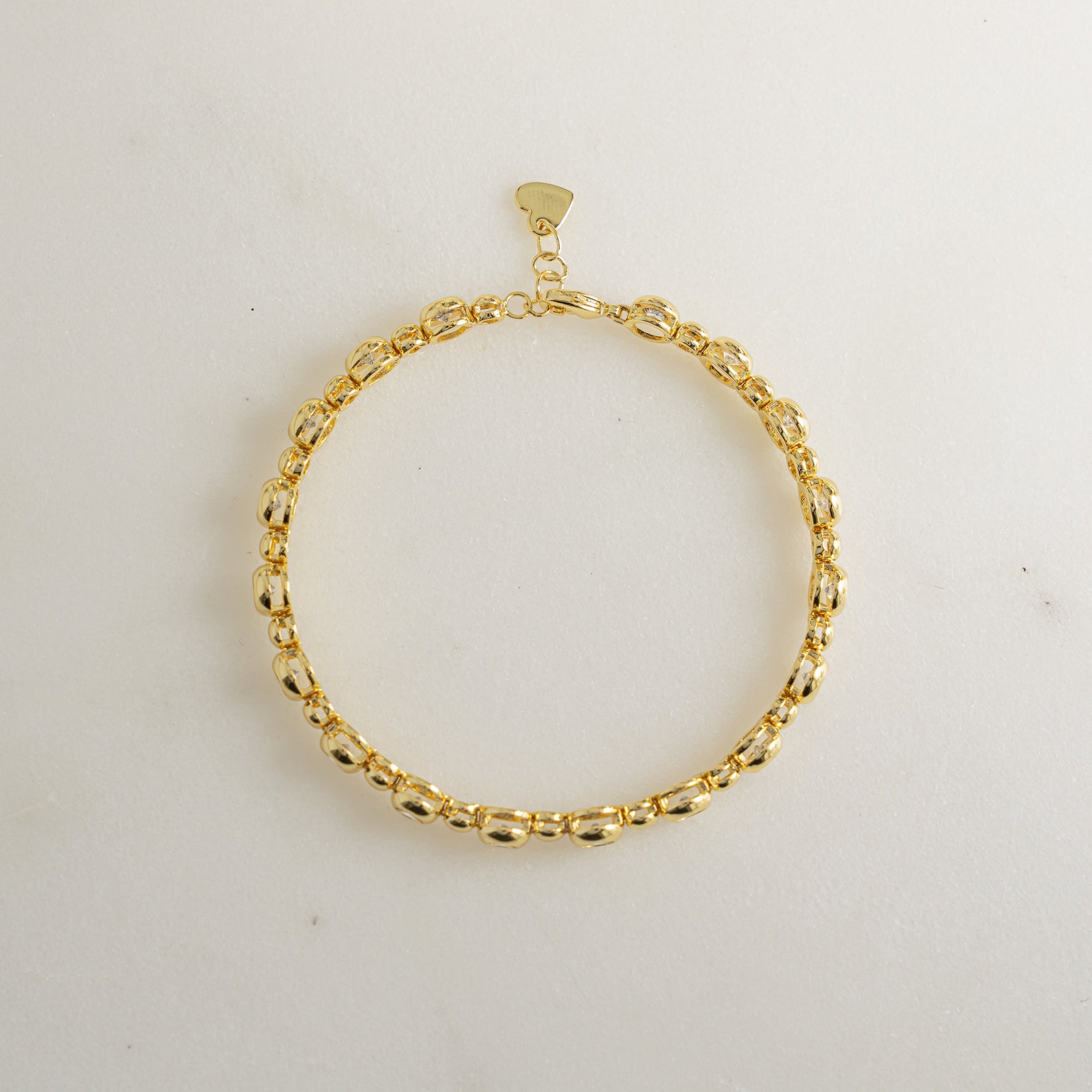 Close-up of a gold dainty bracelet in gold