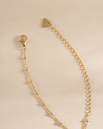 Gold dangling tear drop necklace by Sami Jewels featuring a lobster clasp closure, elegant and stylish jewelry accessory.