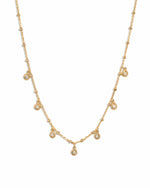 Gold dangling tear drop necklace by Sami Jewels, featuring a delicate teardrop pendant on a fine chain.